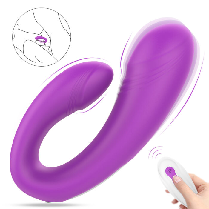 A purple, curved vibrator with a remote control. The main section is large and smooth, and the smaller end is designed for dual stimulation. An inset illustration shows its use. The remote control has a single button for operation.