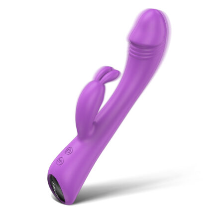 The Baby Bunny is a purple, curved G-spot vibrator for women, featuring a rabbit-like attachment near the base for dual stimulation. It has a smooth finish and a slightly tapered end with a visible seam near the tip. Equipped with both a power button and an additional button for settings, this adult toy is designed to enhance adult pleasure.