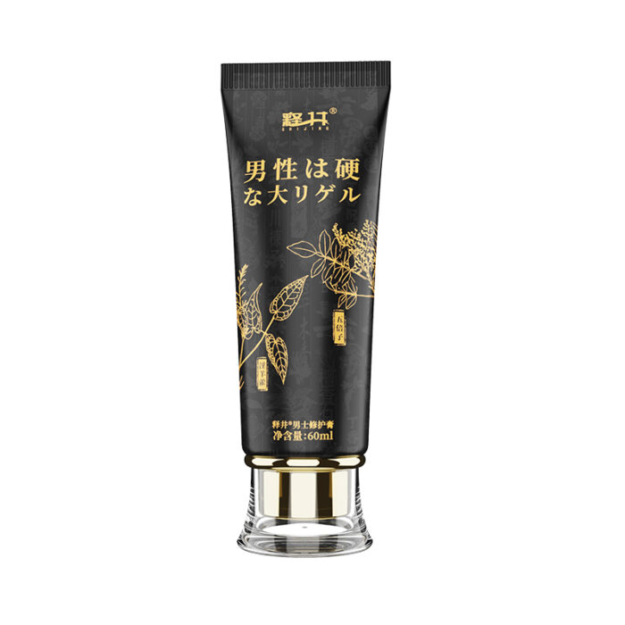 A black tube with gold-colored text and plant illustrations, featuring a product labeled in both Japanese and English. The product, identified as Men's Private Parts Repair Cream Comfort Herbal Extract Golden Gun Ability to Stand Up Extended Cream - Men's Repair Cream 60ml, appears to be a gel and has a transparent base.