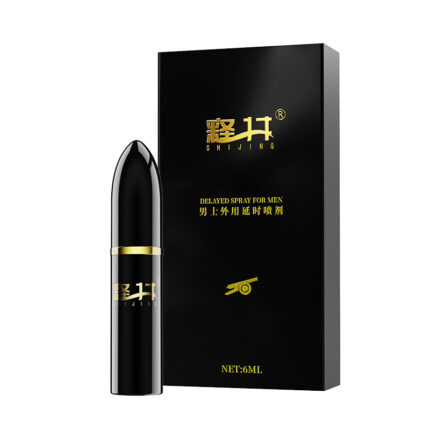 The image displays a black box adorned with gold text that reads "SHIJING" and "DELAYED SPRAY FOR MEN." Accompanying the box is a matching black spray bottle, featuring similar branding and design elements. The label on the bottle indicates it is a 6 ml volume product called "For Men - External Use Spray - Wash Free - Lickable - Long-Lasting - Non Allergic - Delayed Spray (Bullet Head).