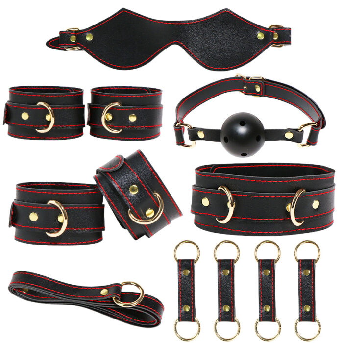 A black BDSM kit that includes wrist cuffs, ankle cuffs, collar, leash, ball gag, and blindfold. Made from high-quality leather and metal, this set is designed to enhance your bondage play and explore new sensations. Perfect for couples looking to add excitement to their intimate moments.