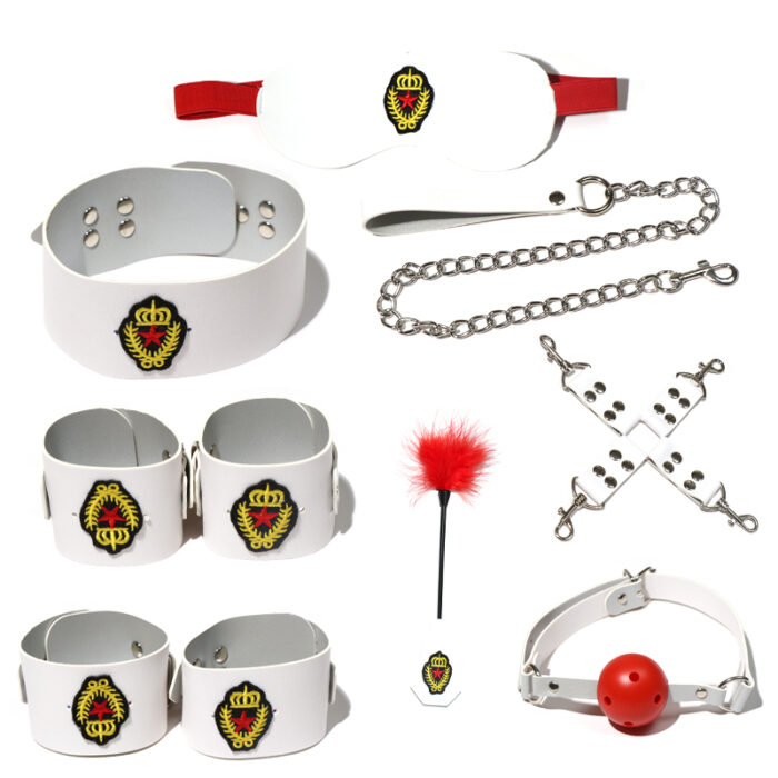 A white BDSM kit that includes wrist cuffs, ankle cuffs, collar, leash, ball gag, blindfold, and feather tickler. Made from high-quality materials, this set is designed to add a playful and colorful touch to your bondage play. Perfect for couples looking to explore their fantasies.