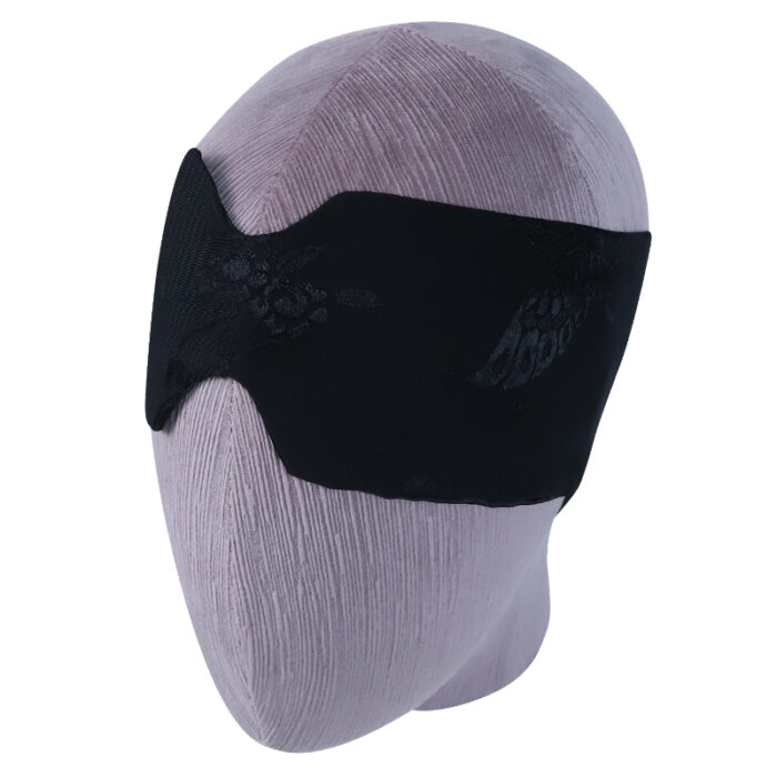 Black blindfold on a head mannequin for sensory deprivation and adult play.